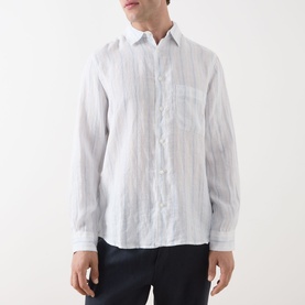 Model wearing Samsoe & Samsoe Ryan Striped Shirt in Clear Blue St., long sleeves, chest pocket, button fastening, styled with navy trousers