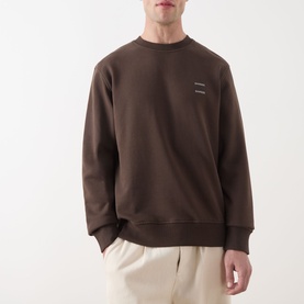 Model wearing Samsoe & Samsoe Joel Logo Sweatshirt in Turkish Coffee, crew neck with ribbed trims and small logo detail, styled with cream trousers