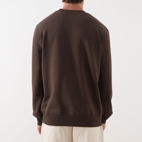 Model wearing Samsoe & Samsoe Joel Logo Sweatshirt in Turkish Coffee. Rear view showing crew neck, ribbed hem and cuffs.