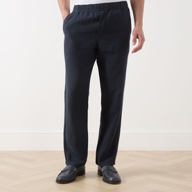 Model wearing Samsoe & Samsoe Jabari Casual Trousers in Salute, slim-leg linen with elasticated waistband, styled with dark loafers
