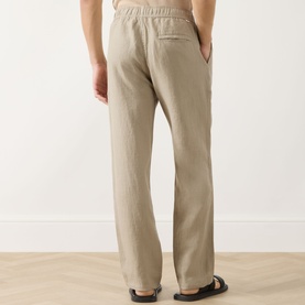 Model wearing Samsoe & Samsoe Jabari Regular-Fit Trousers in Aluminium linen, elasticated waistband, straight leg, back patch pocket visible