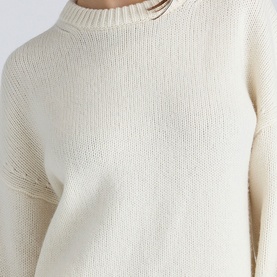 Model wearing House of CB ivory ribbed knit jumper with mock turtleneck, close-up detail shot