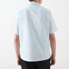 Model wearing Fred Perry Casual Shirt in Light Ice, rear view showing short sleeves, relaxed fit, and textured cotton fabric