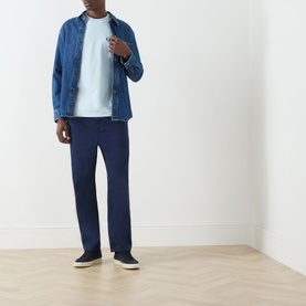 Model wearing Fred Perry Light Ice Crew Neck T-shirt, styled with denim jacket, navy trousers and dark slip-on shoes.