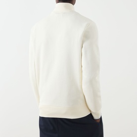 Model wearing Fred Perry Half Zip sweat in Ecru, rear view, styled with French Navy trousers