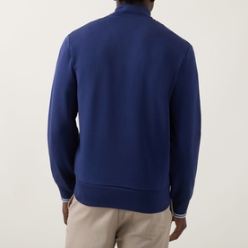 Model wearing Fred Perry Wreath Logo Half-Zip Sweatshirt in French Navy/Dusky Blue, rear view, with ribbed trims and funnel neck