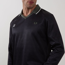 Model wearing Fred Perry Meyba Long-Sleeve T-Shirt in Black with notched V-neckline, flat collar, and laurel wreath logo detail.