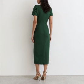 Model wearing Reiss teal green midi dress with short sleeves and fitted silhouette, styled with gold strappy heels, rear view