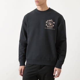 Model wearing Scotch & Soda Floral Graphic Logo Sweatshirt in Meteorite with crew neck, ribbed trims and chest logo graphic.