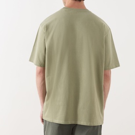 Model wearing Scotch & Soda 3 Crosses Logo T-Shirt in Oil Green 300, back view, round neck, short sleeves, relaxed fit, 100% cotton