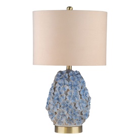 Mindy Browne Olivia Floral Table Lamp in blue ceramic with textured floral detailing, brass base, and cream linen drum shade.