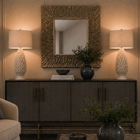 Mindy Browne Grace Textured Ivory Ceramic Table Lamp with linen shade, styled on sideboard beside mirror and matching lamp.