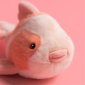 Jellycat pink and cream guinea pig plush toy, close-up showing soft fur texture and embroidered facial details