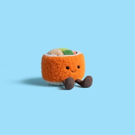 Jellycat small orange sushi roll plush toy with smiling face, green topping detail, and brown legs on light blue background