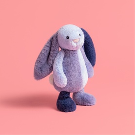 Jellycat plush bunny soft toy in lilac and navy blue with long floppy ears, small bead eyes, and fluffy textured body