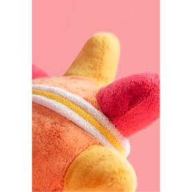 Jellycat plush soft toy close-up detail showing orange, yellow and pink fluffy texture with gold stripe trim detail.