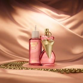 Jean Paul Gaultier Gaultier Divine Couture EDP 100ml with refill bottle, pink fragrance with gold heart-shaped cap, on satin background