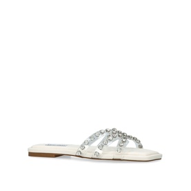 Steve Madden Loretto Flat Sandals in white with clear crystal-embellished crossover straps and flat sole, side view