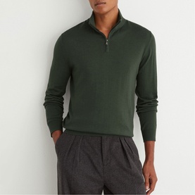 Model wearing Reiss dark green quarter-zip knit jumper, styled with grey marl trousers