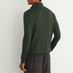 Model wearing Reiss dark green half-zip knit pullover, back view, styled with grey trousers.