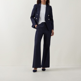 Model wearing Ted Baker Eliviab Dark Blue Double-Breasted Blazer with matching wide-leg trousers, white T-shirt and navy flats.