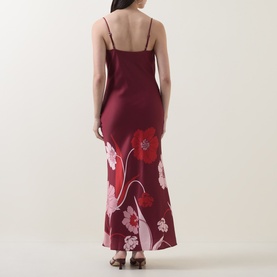 Model wearing Ted Baker Indora Floral Slip Dress in dark red, showing back view with floral print, narrow straps, and flared maxi hem
