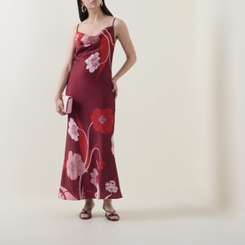 Model wearing Ted Baker Indora Floral Slip Dress in dark red, satin finish, cowl neck, maxi length, styled with strappy heels and clutch bag