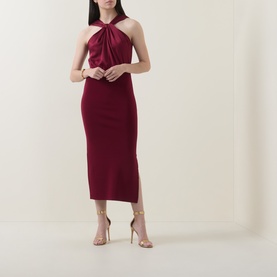 Model wearing Ted Baker Mellana Twist-Detail Dress in Burnt Red, halter neck with twist detail, midi length, side split, styled with gold heeled