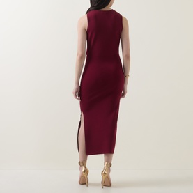 Model wearing Ted Baker Mellana Twist-Detail Dress in Burnt Red, midi length with side split, styled with gold heeled sandals.