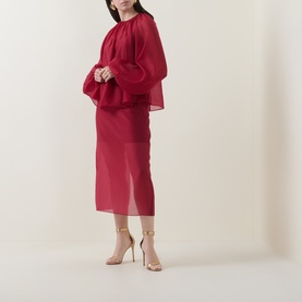 Model wearing Ted Baker Deka Semi-Sheer Layered Skirt in dark red midi length, styled with matching top and nude heeled sandals.