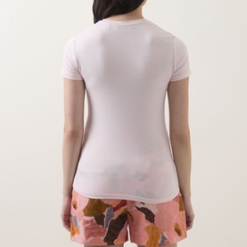 Model wearing Ted Baker Bindii Placement Floral T-Shirt in coral, back view, with floral-print shorts.