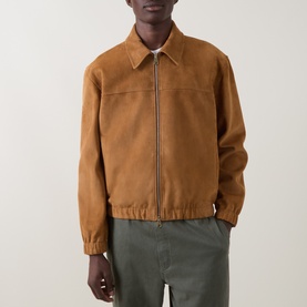 Model wearing Paul Smith brown suede casual jacket with zip fastening and elasticated cuffs, styled with khaki trousers.