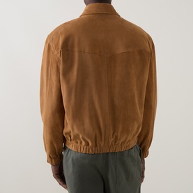 Model wearing Paul Smith brown suede casual jacket, rear view, with elasticated hem and cuffs, styled with khaki trousers.