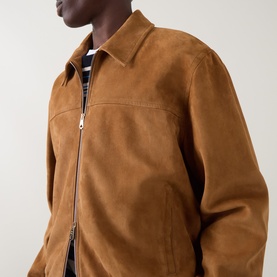 Model wearing Paul Smith brown suede casual jacket with zip fastening and collar, styled with a striped top underneath.