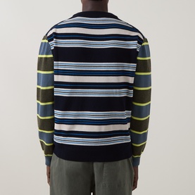 Model wearing Paul Smith Blue Striped Lambswool Crew Neck Jumper, back view, with navy, yellow, and white horizontal stripes.