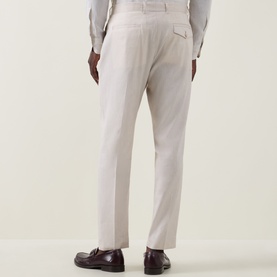 Model wearing Paul Smith white linen-wool formal trousers, rear view, styled with burgundy leather loafers