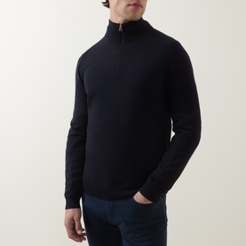 Model wearing Paul Smith Half-Zip Regular-Fit Sweater in navy merino wool with funnel neck and half-zip, styled with dark jeans.