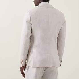 Model wearing Paul Smith white linen-wool blazer, rear view, paired with matching white trousers.