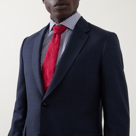 Model wearing Paul Smith navy wool suit jacket with blue striped shirt and red tie