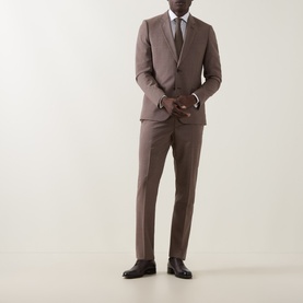 Model wearing Paul Smith Soho Single-Breasted Two-Piece Suit in brown wool, styled with white shirt and brown leather shoes.