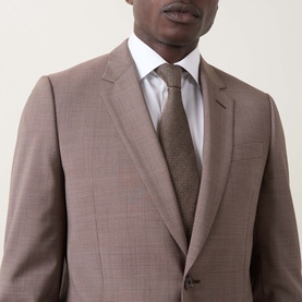 Model wearing Paul Smith Soho Single-Breasted Two-Piece Suit in brown, styled with a white shirt and brown knit tie.