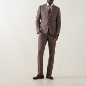 Model wearing Paul Smith Soho Single-Breasted Two-Piece Suit in brown, styled with white shirt, grey tie and dark brown leather shoes.