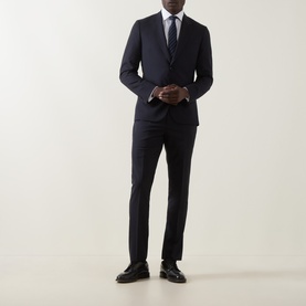 Model wearing Paul Smith Soho Pinstripe Single-Breasted Two-Piece Suit in navy wool, styled with white shirt, tie, and black leather shoes.