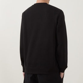 Model wearing Hugo Diragol Logo Sweatshirt in black, rear view showing crew neck, long sleeves and ribbed trims. Styled with black trousers.