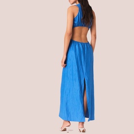 Model wearing blue open-back maxi dress with halter neckline, side split, and crinkled fabric finish, shown from behind