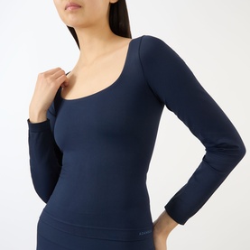 Model wearing Adanola navy blue long-sleeve top with square neckline and seamless ribbed finish.