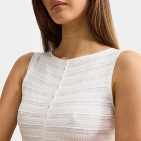 Model wearing Forever New dress in Porcelain, featuring textured lace stripe detail and sleeveless design with front button placket.