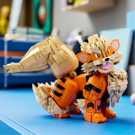 Lego Pok&eacute;mon Arcanine buildable figure in orange, black and tan, displayed on a blue surface