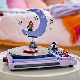 Lego Editions Music turntable toy set in purple with crescent moon stage, star details, and mini-figure, displayed on white surface