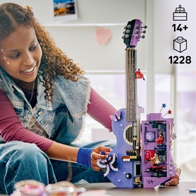 Model with Lego purple electric guitar building set, 1228 pieces, age 14+, with decorated body and mini scene detail